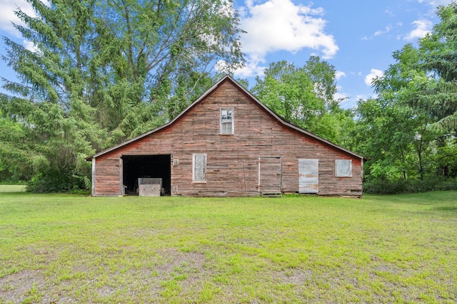 39665 8th Ave, North Branch, MN 55056 - view of home's exterior with a yard, a barn, an outbuilding, and a detached garage