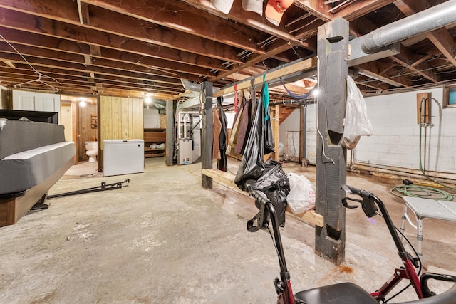 39665 8th Ave, North Branch, MN 55056 - unfinished basement featuring white refrigerator and heating unit