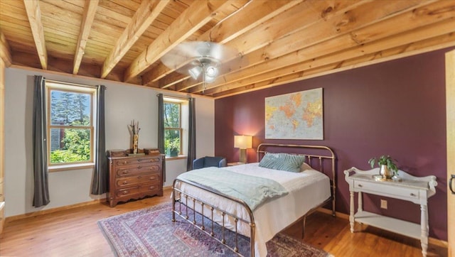 8825 Greeley Loop, Royalton Twp, MN 55006 - bedroom with a wooden ceiling with exposed beams, wood finished floors, and a ceiling fan