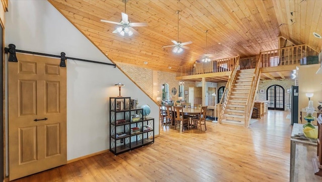 8825 Greeley Loop, Royalton Twp, MN 55006 - dining space featuring a ceiling fan, stairway, wood-type flooring, wooden ceiling, and vaulted ceiling