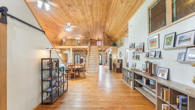 8825 Greeley Loop, Royalton Twp, MN 55006 - hall featuring wood ceiling, high vaulted ceiling, and wood finished floors