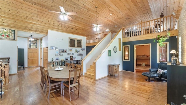 8825 Greeley Loop, Royalton Twp, MN 55006 - dining room featuring ceiling fan, stairs, wood finished floors, a towering ceiling, and wooden ceiling