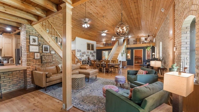 8825 Greeley Loop, Royalton Twp, MN 55006 - building lobby featuring stairs, brick wall, wooden ceiling, and a high ceiling