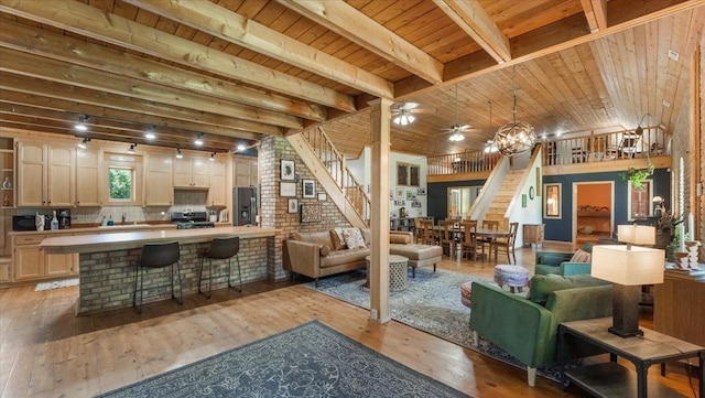 8825 Greeley Loop, Royalton Twp, MN 55006 - living area featuring stairs, a wooden ceiling with exposed beams, light wood-type flooring, and a ceiling fan