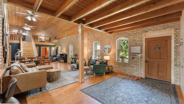 8825 Greeley Loop, Royalton Twp, MN 55006 - living room with brick wall, a wood ceiling with exposed beams, wood finished floors, and a ceiling fan