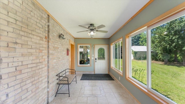 8825 Greeley Loop, Royalton Twp, MN 55006 - unfurnished sunroom featuring crown molding, brick wall, and tile patterned flooring
