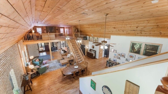 8825 Greeley Loop, Royalton Twp, MN 55006 - living area with wood ceiling, wood finished floors, high vaulted ceiling, and a ceiling fan