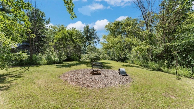 8825 Greeley Loop, Royalton Twp, MN 55006 - view of grassy yard featuring a fire pit