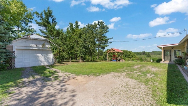 8825 Greeley Loop, Royalton Twp, MN 55006 - view of green lawn featuring a detached garage and an outdoor structure