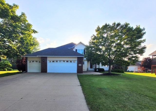 7274 Berkshire Cir, Shakopee, MN 55379 - view of front of property featuring a garage, a front yard, driveway, and brick siding