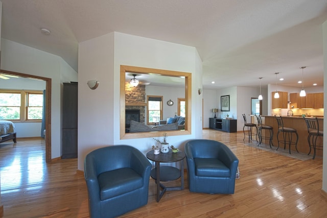 10199 330th St W, Northfield, MN 55057 - living room featuring light wood finished floors, a fireplace, and recessed lighting