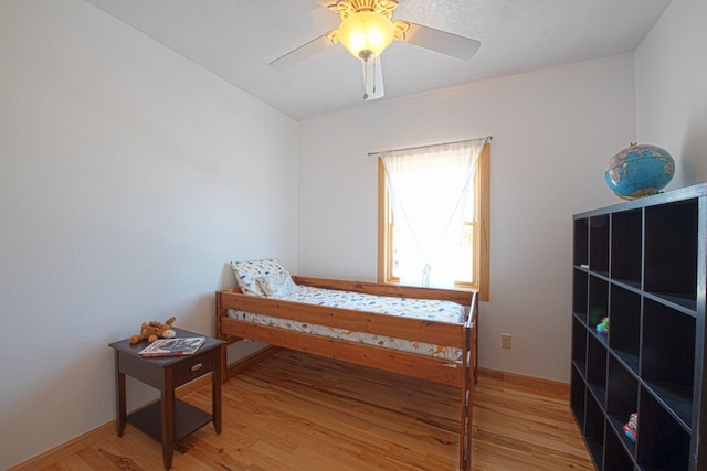 10199 330th St W, Northfield, MN 55057 - bedroom with light wood-style floors and a ceiling fan