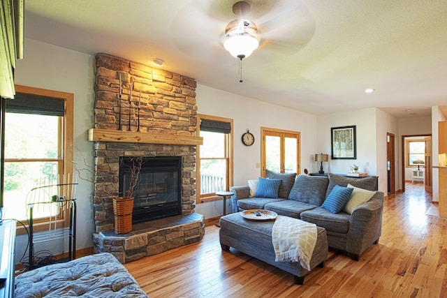 10199 330th St W, Northfield, MN 55057 - living room with ceiling fan, light wood-style flooring, healthy amount of natural light, and a fireplace