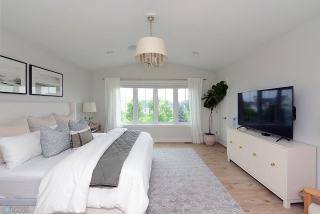 2630 2nd St E, Fargo, ND 58078 - bedroom featuring vaulted ceiling and light wood-style flooring