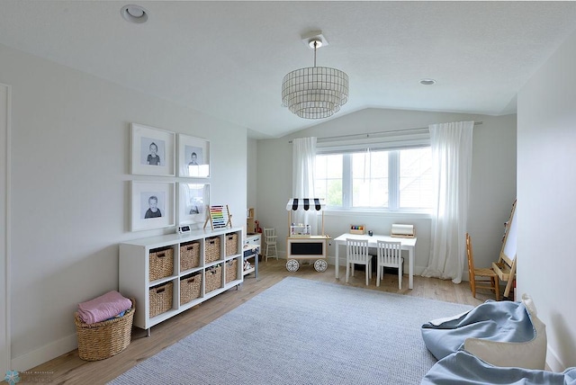 2630 2nd St E, Fargo, ND 58078 - rec room featuring wood finished floors, lofted ceiling, and a chandelier