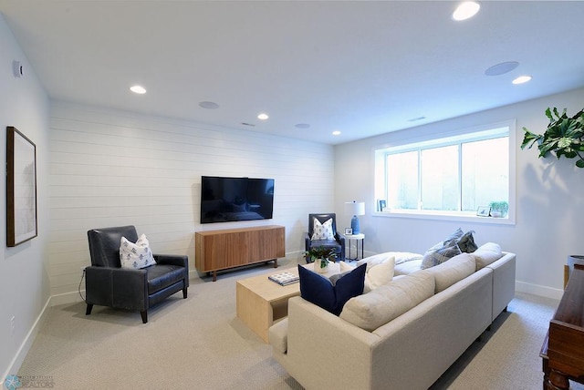 2630 2nd St E, Fargo, ND 58078 - living room featuring recessed lighting, wooden walls, and light colored carpet