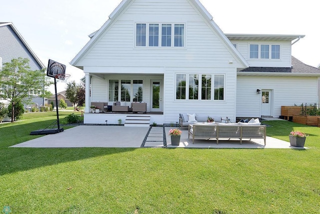 2630 2nd St E, Fargo, ND 58078 - rear view of house with an outdoor hangout area, a patio, and a lawn