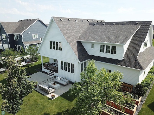 2630 2nd St E, Fargo, ND 58078 - back of property featuring outdoor lounge area, roof with shingles, a patio, and a yard