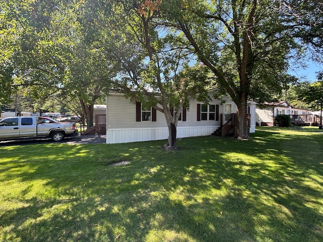 2126 3rd Ave NW Unit 80, Owatonna, MN 55060 - view of side of home with a lawn