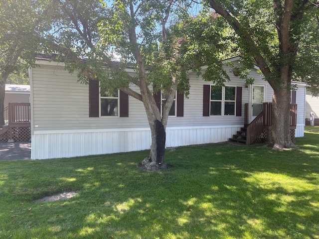 2126 3rd Ave NW Unit 80, Owatonna, MN 55060 - view of front of house featuring a front yard