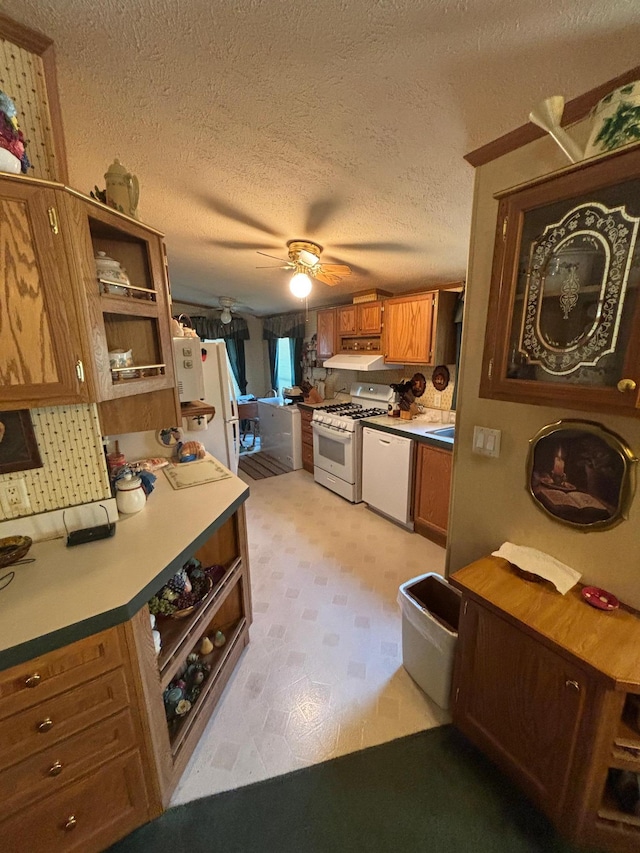 2126 3rd Ave NW Unit 80, Owatonna, MN 55060 - kitchen with white appliances, brown cabinets, open shelves, a textured ceiling, and ceiling fan