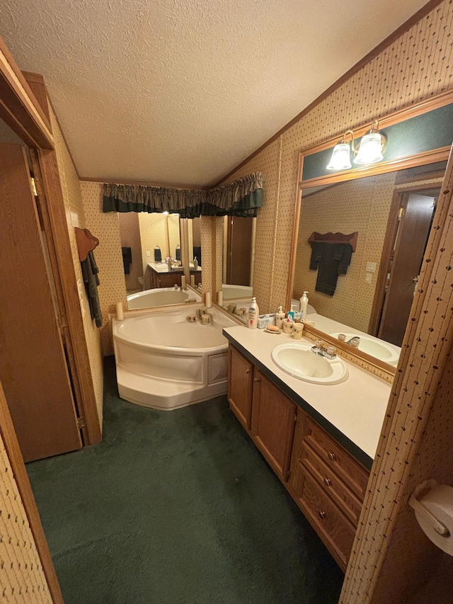 2126 3rd Ave NW Unit 80, Owatonna, MN 55060 - bathroom with a garden tub, vanity, a textured ceiling, and wallpapered walls