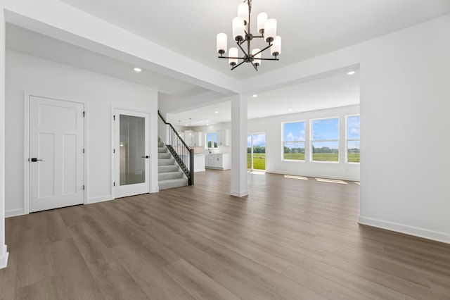 9863 49th St NE, Saint Michael, MN 55376 - unfurnished living room featuring stairway, a chandelier, wood finished floors, and recessed lighting