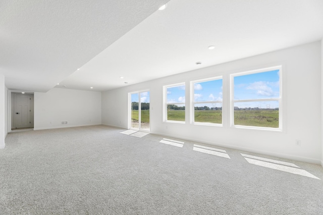 9863 49th St NE, Saint Michael, MN 55376 - unfurnished living room with light carpet and recessed lighting