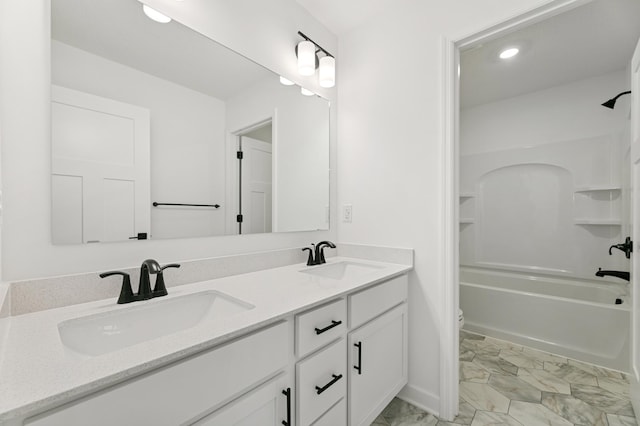 9863 49th St NE, Saint Michael, MN 55376 - bathroom with double vanity, shower / tub combination, recessed lighting, and marble look tile flooring
