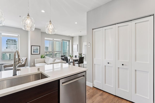 929 Portland Ave Unit 2510, Minneapolis, MN 55404 - kitchen featuring dishwasher, light countertops, plenty of natural light, pendant lighting, and recessed lighting