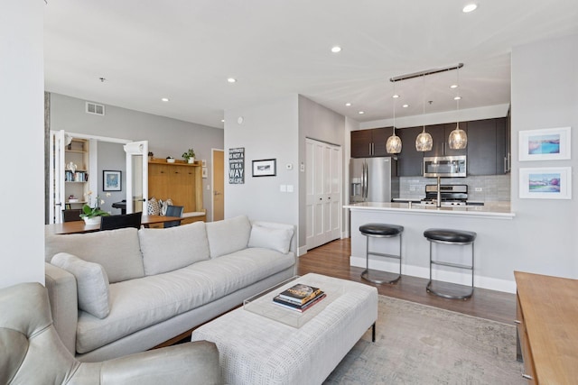 929 Portland Ave Unit 2510, Minneapolis, MN 55404 - living room featuring wood finished floors and recessed lighting