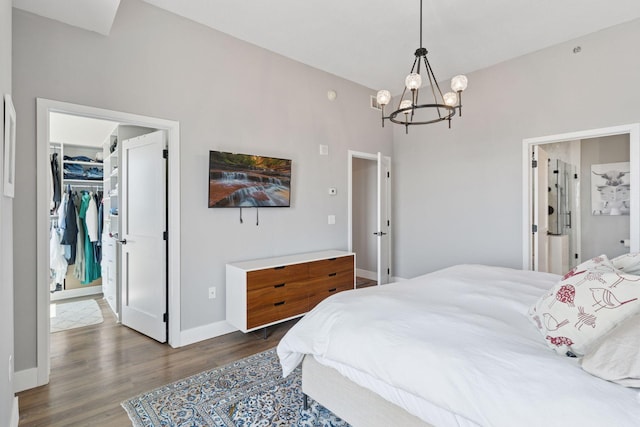 929 Portland Ave Unit 2510, Minneapolis, MN 55404 - bedroom featuring a chandelier, a walk in closet, and wood finished floors