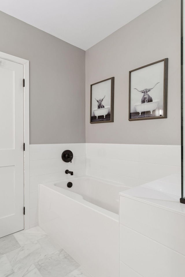 929 Portland Ave Unit 2510, Minneapolis, MN 55404 - bathroom with marble look tile flooring and a garden tub
