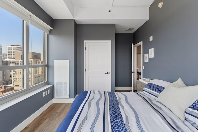 929 Portland Ave Unit 2510, Minneapolis, MN 55404 - bedroom with wood finished floors and a city view