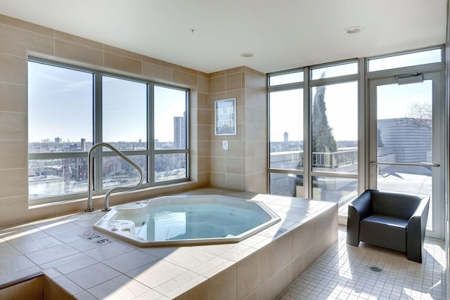 929 Portland Ave Unit 2510, Minneapolis, MN 55404 - bathroom with a tub with jets, a city view, and tile patterned flooring