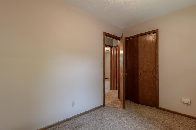 315 Pierce Ave, North Mankato, MN 56003 - unfurnished bedroom featuring light colored carpet and a closet