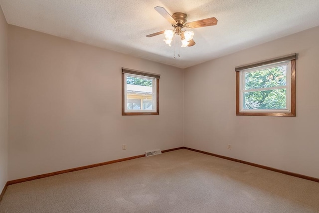 315 Pierce Ave, North Mankato, MN 56003 - spare room featuring light carpet and ceiling fan