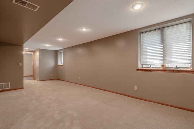 315 Pierce Ave, North Mankato, MN 56003 - below grade area with light carpet and recessed lighting