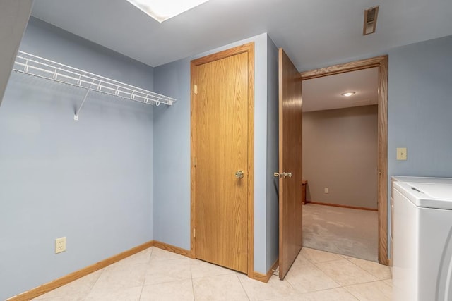 315 Pierce Ave, North Mankato, MN 56003 - laundry room with washer / dryer and light tile patterned floors