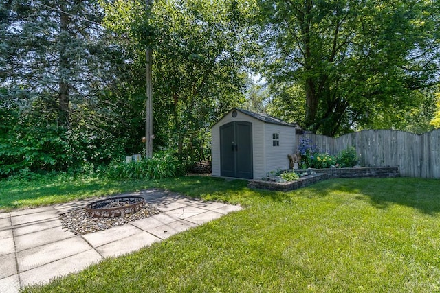 315 Pierce Ave, North Mankato, MN 56003 - view of yard featuring an outdoor fire pit and a shed