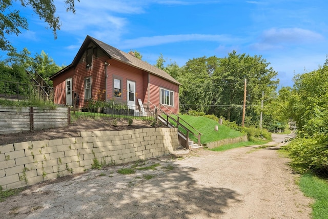 1818 1st St N, Stillwater, MN 55082 - view of side of property featuring a shingled roof