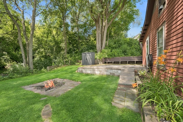 1818 1st St N, Stillwater, MN 55082 - view of grassy yard with an outdoor fire pit and a patio