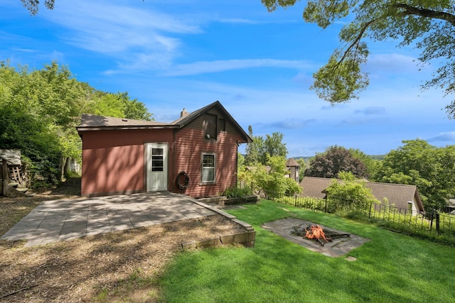 1818 1st St N, Stillwater, MN 55082 - view of front of property with an outdoor fire pit, a patio, and a chimney