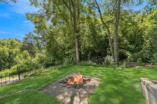 1818 1st St N, Stillwater, MN 55082 - view of yard featuring a fire pit and a view of trees
