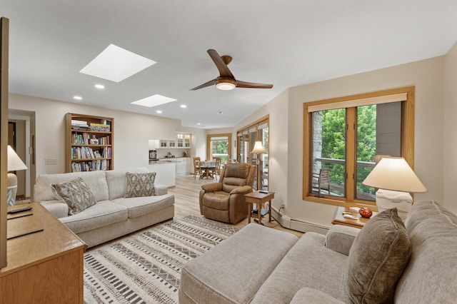 14575 Burma Ave W Unit 306, Rosemount, MN 55068 - living area featuring a skylight, plenty of natural light, recessed lighting, a baseboard heating unit, and light wood-style flooring