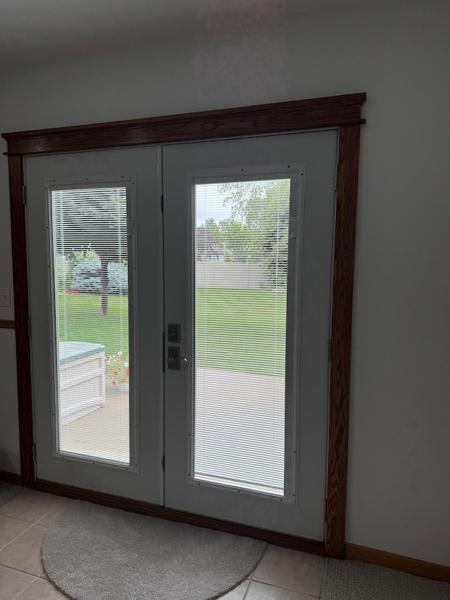 2518 Parkhill Ln SW, Rochester, MN 55902 - doorway featuring light tile patterned flooring and baseboards