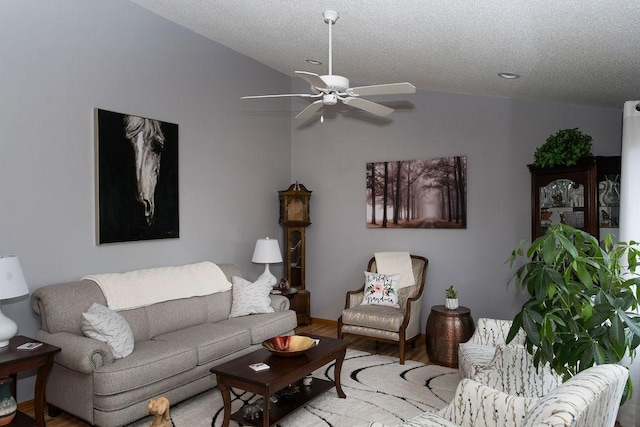 2518 Parkhill Ln SW, Rochester, MN 55902 - living area with vaulted ceiling, a ceiling fan, wood finished floors, and a textured ceiling
