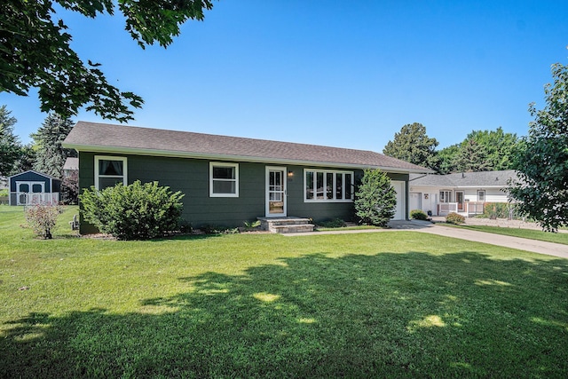 501 Central Ln, Luverne, MN 56156 - ranch-style home with an attached garage, a front lawn, concrete driveway, and roof with shingles