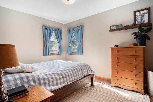 501 Central Ln, Luverne, MN 56156 - bedroom featuring wood finished floors and baseboards
