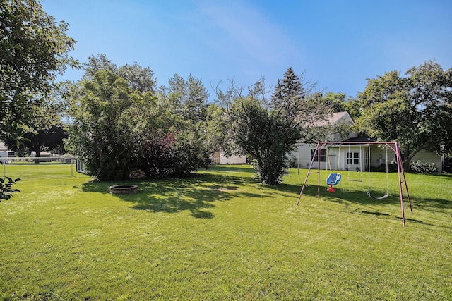 501 Central Ln, Luverne, MN 56156 - view of yard featuring a playground and an outdoor fire pit